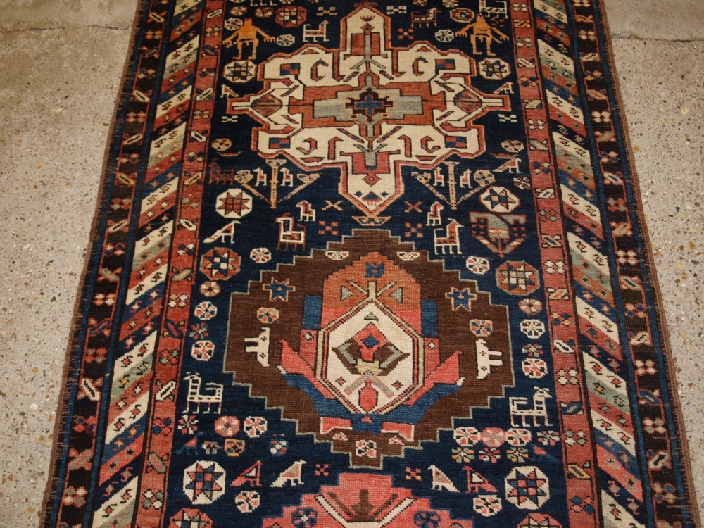 ANTIQUE SOUTH EAST CAUCASIAN RUNNER, SOFT COLOURS, PEOPLE AND ANIMALS, CIRCA 1900. View V