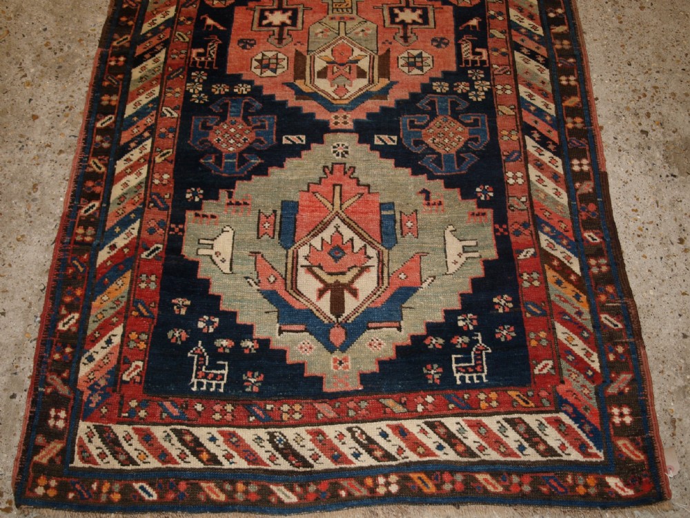 ANTIQUE SOUTH EAST CAUCASIAN RUNNER, SOFT COLOURS, PEOPLE AND ANIMALS, CIRCA 1900. View VI
