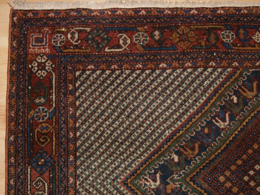 OLD KHAMSEH RUG, TRIPLE MEDALLION WITH BIRDS, CIRCA 1920. View III