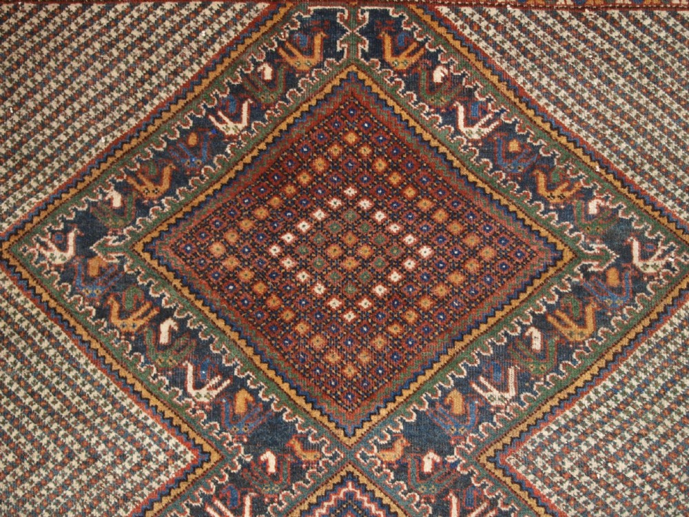 OLD KHAMSEH RUG, TRIPLE MEDALLION WITH BIRDS, CIRCA 1920. View VII