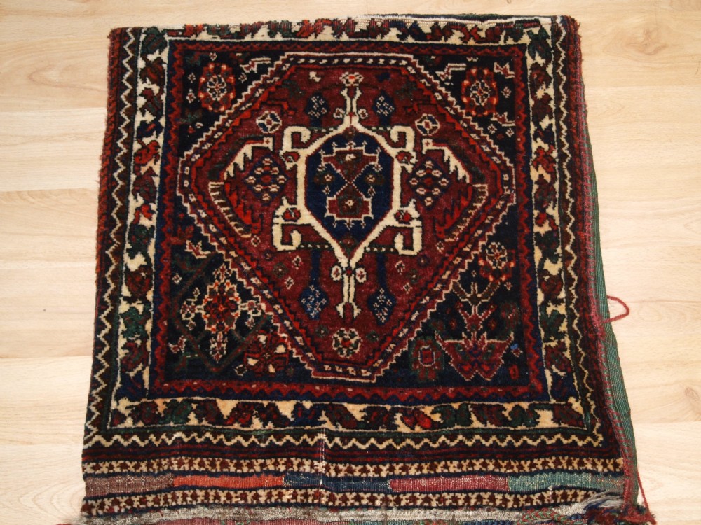 ANTIQUE COMPLETE QASHQAI KHORJIN SADDLE BAGS WITH PLAIN WEAVE BACK, CIRCA 1900/20. View II