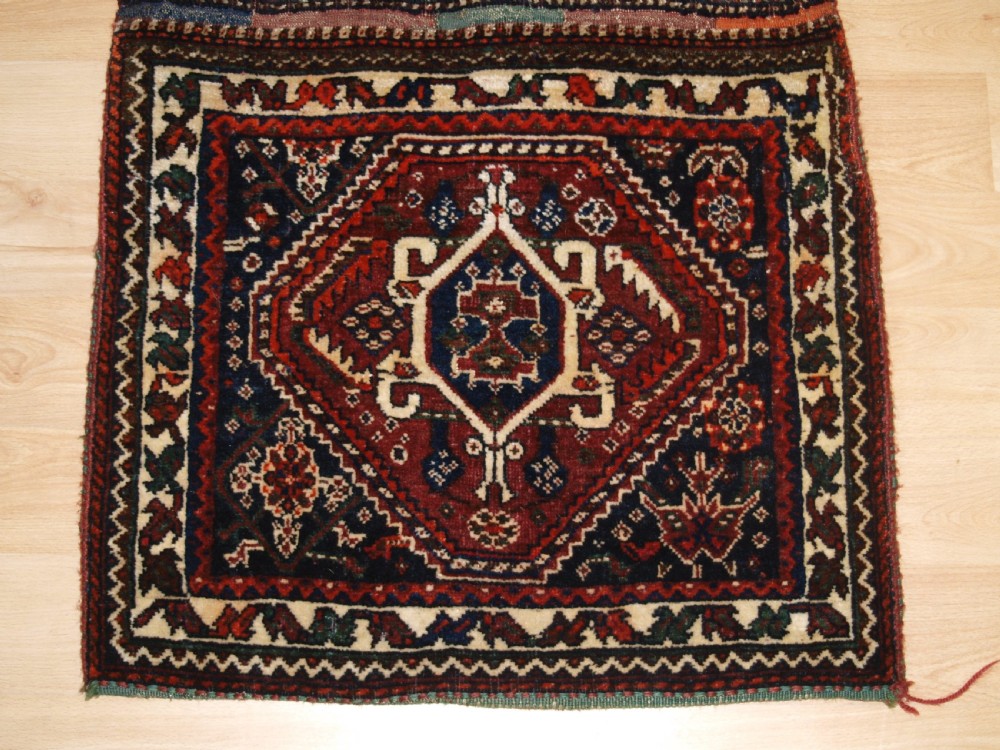 ANTIQUE COMPLETE QASHQAI KHORJIN SADDLE BAGS WITH PLAIN WEAVE BACK, CIRCA 1900/20. View III