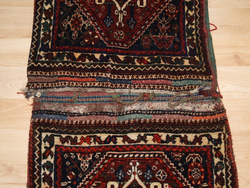 ANTIQUE COMPLETE QASHQAI KHORJIN SADDLE BAGS WITH PLAIN WEAVE BACK, CIRCA 1900/20. View IV