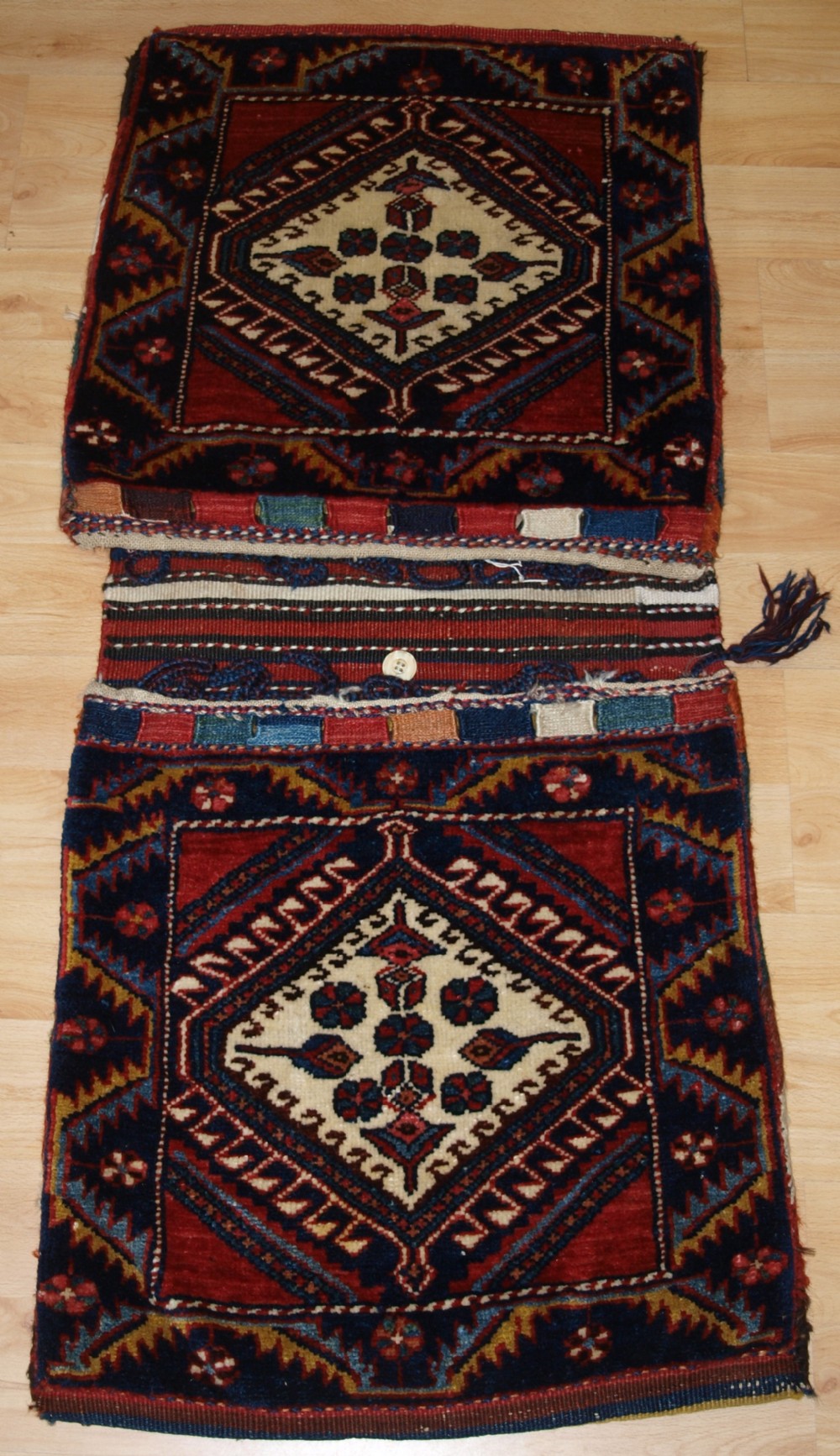 ANTIQUE COMPLETE LURI FARS REGION KHORJIN SADDLE BAGS WITH PLAIN WEAVE BACK, CIRCA 1900/20.