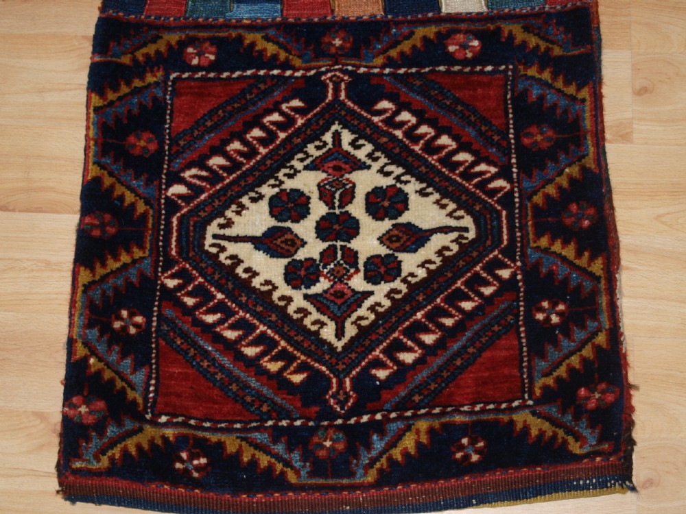 ANTIQUE COMPLETE LURI FARS REGION KHORJIN SADDLE BAGS WITH PLAIN WEAVE BACK, CIRCA 1900/20. View IV