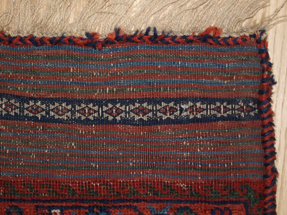 An antique hand-knotted Afshar rug featuring a repeating geometric Herati pattern in deep red, navy blue, and cream with a multi-band decorative border. View XII