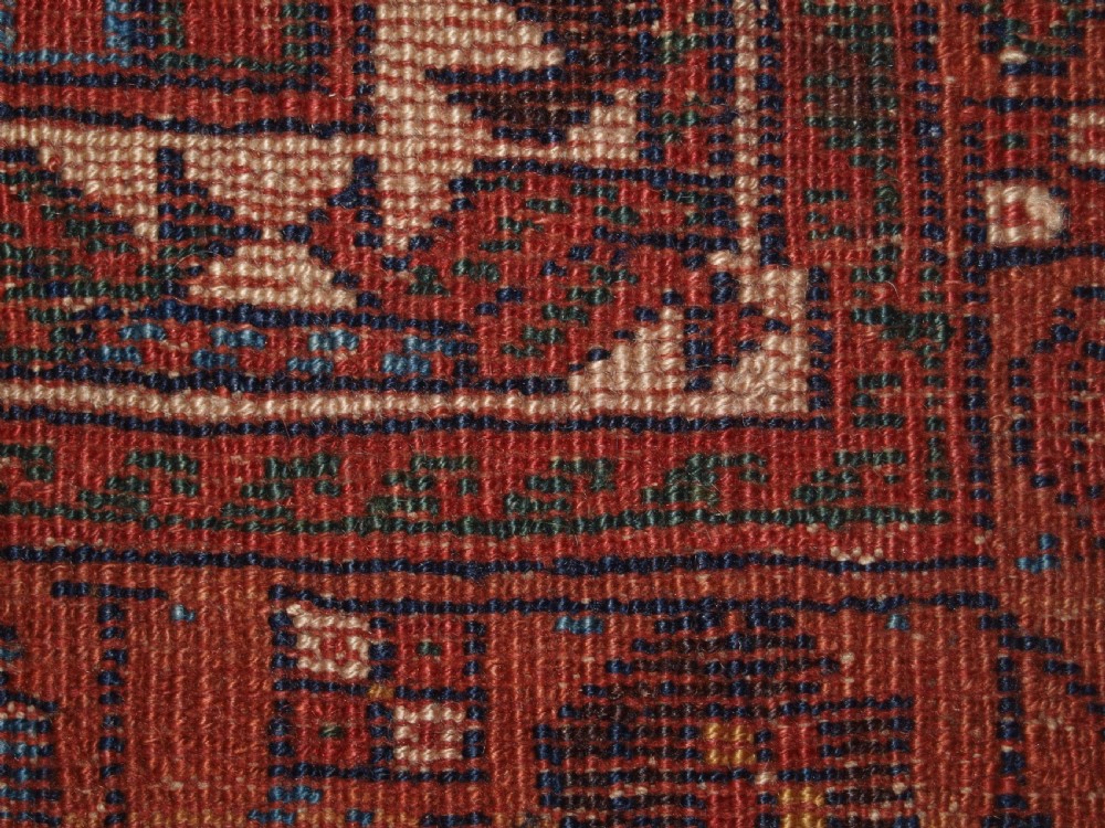 An antique hand-knotted Afshar rug featuring a repeating geometric Herati pattern in deep red, navy blue, and cream with a multi-band decorative border. View XIII