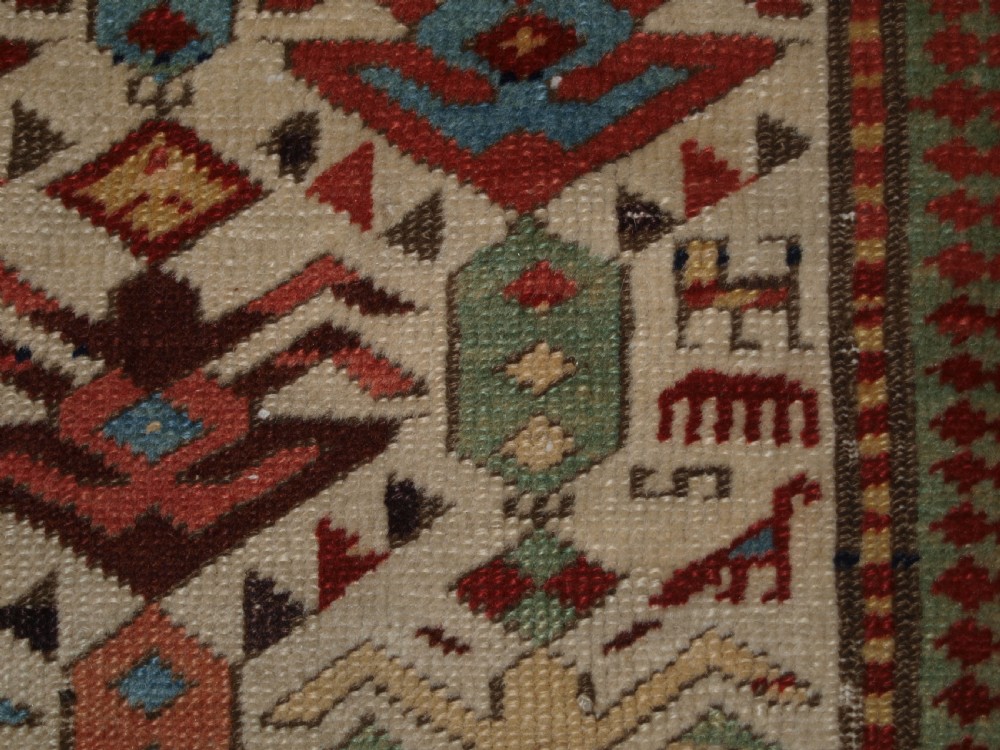 ANTIQUE CAUCASIAN AKSTAFA PRAYER RUG, IVORY GROUND WITH SUPERB COLOUR, 2ND HALF 19TH CENTURY. View XII