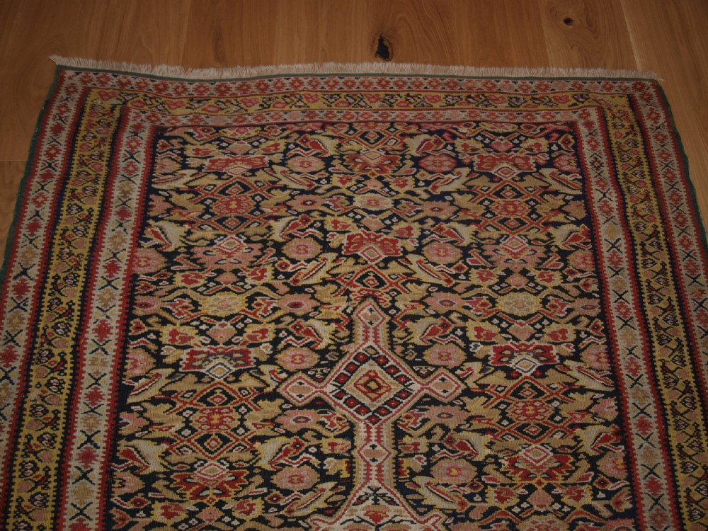 ANTIQUE SENNEH KILIM WITH MEDALLION DESIGN, SOFT COLOURS, CIRCA 1900. View III