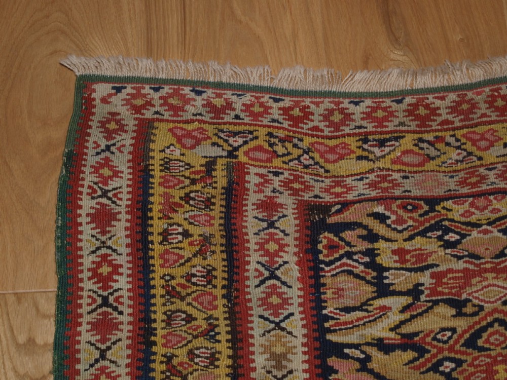 ANTIQUE SENNEH KILIM WITH MEDALLION DESIGN, SOFT COLOURS, CIRCA 1900. View VI