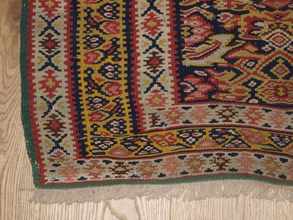 ANTIQUE SENNEH KILIM WITH MEDALLION DESIGN, SOFT COLOURS, CIRCA 1900. View VIII