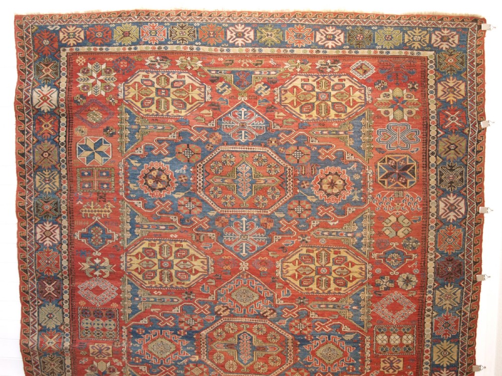 ANTIQUE CAUCASIAN THREE MEDALLION SOUMAK CARPET OF RARE DESIGN, SUPERB COLOUR, CIRCA 1880. View II