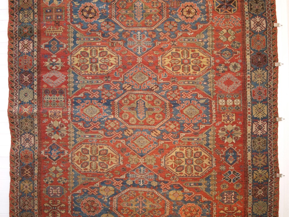 ANTIQUE CAUCASIAN THREE MEDALLION SOUMAK CARPET OF RARE DESIGN, SUPERB COLOUR, CIRCA 1880. View III