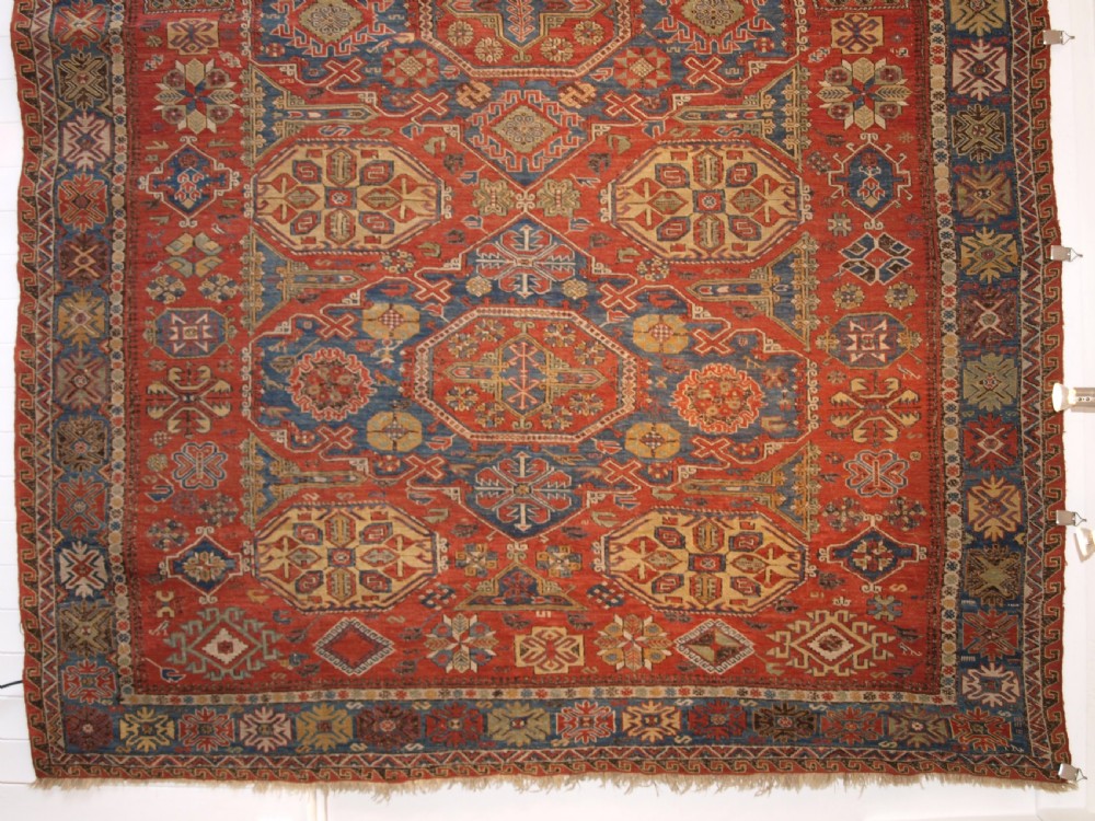 ANTIQUE CAUCASIAN THREE MEDALLION SOUMAK CARPET OF RARE DESIGN, SUPERB COLOUR, CIRCA 1880. View IV