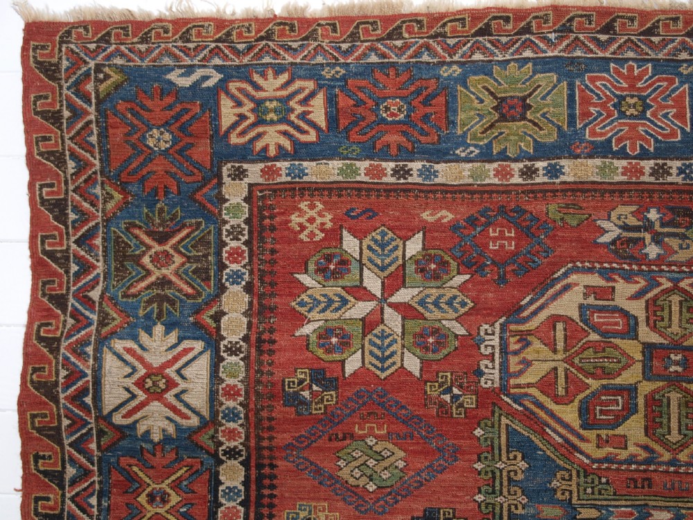 ANTIQUE CAUCASIAN THREE MEDALLION SOUMAK CARPET OF RARE DESIGN, SUPERB COLOUR, CIRCA 1880. View V