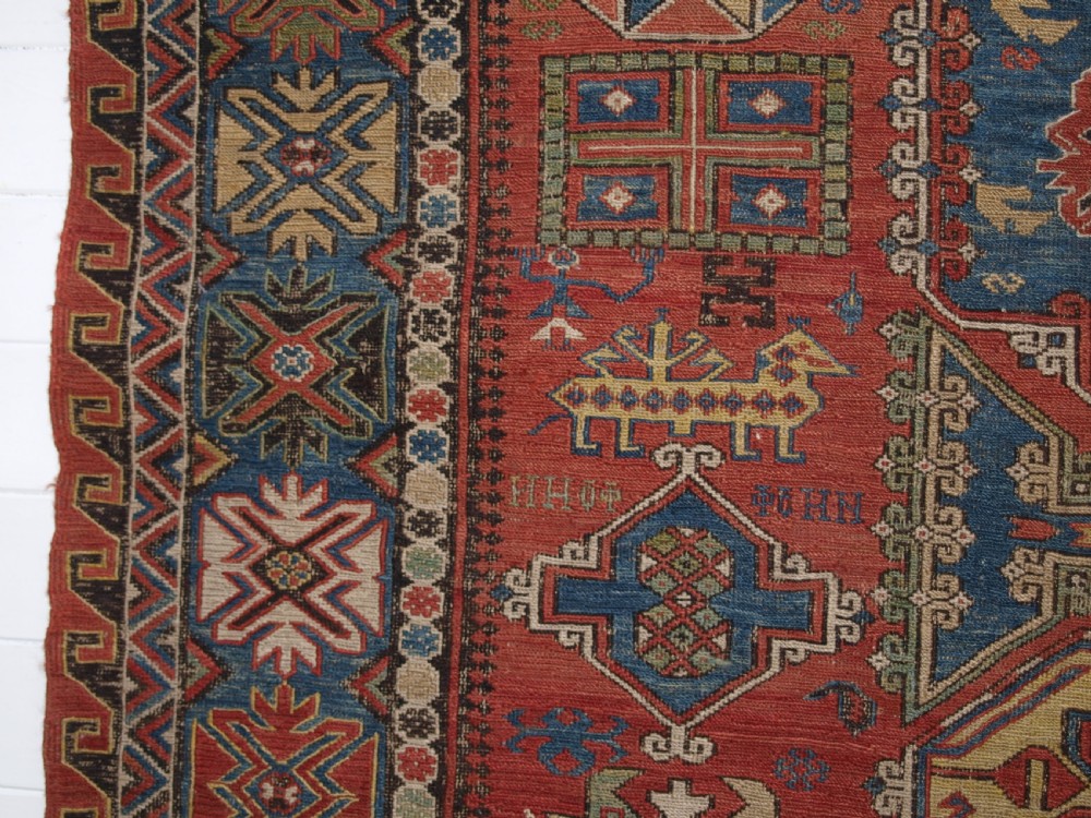ANTIQUE CAUCASIAN THREE MEDALLION SOUMAK CARPET OF RARE DESIGN, SUPERB COLOUR, CIRCA 1880. View VI