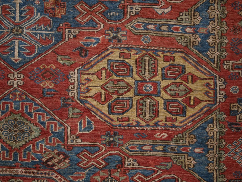 ANTIQUE CAUCASIAN THREE MEDALLION SOUMAK CARPET OF RARE DESIGN, SUPERB COLOUR, CIRCA 1880. View VIII
