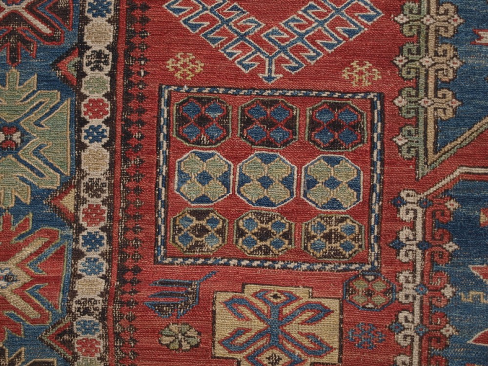 ANTIQUE CAUCASIAN THREE MEDALLION SOUMAK CARPET OF RARE DESIGN, SUPERB COLOUR, CIRCA 1880. View IX