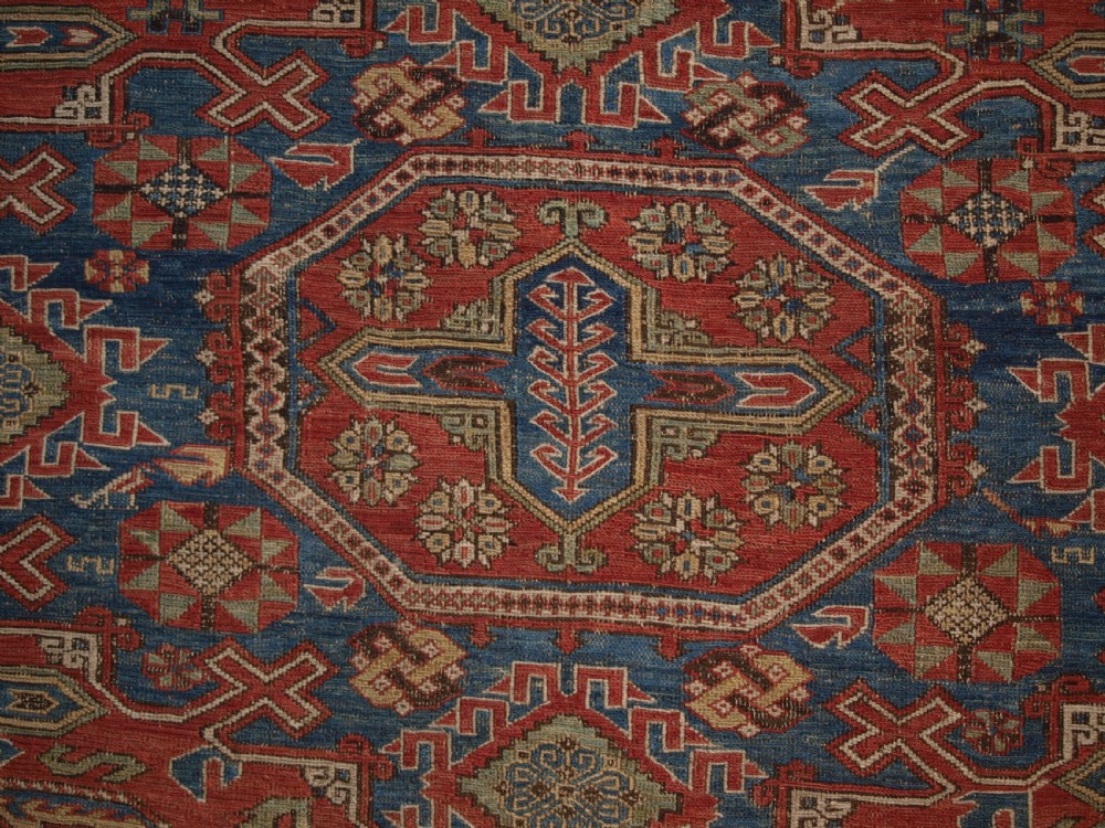 ANTIQUE CAUCASIAN THREE MEDALLION SOUMAK CARPET OF RARE DESIGN, SUPERB COLOUR, CIRCA 1880. View X