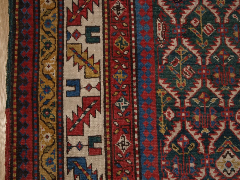 ANTIQUE CAUCASIAN DAGHESTAN RUG WITH SCARCE GREEN GROUND, LATTICE DESIGN, CIRCA 1880. View III