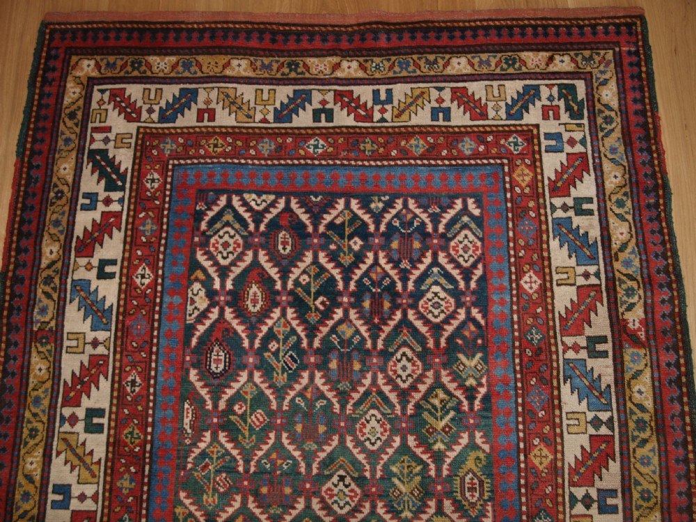 ANTIQUE CAUCASIAN DAGHESTAN RUG WITH SCARCE GREEN GROUND, LATTICE DESIGN, CIRCA 1880. View IV