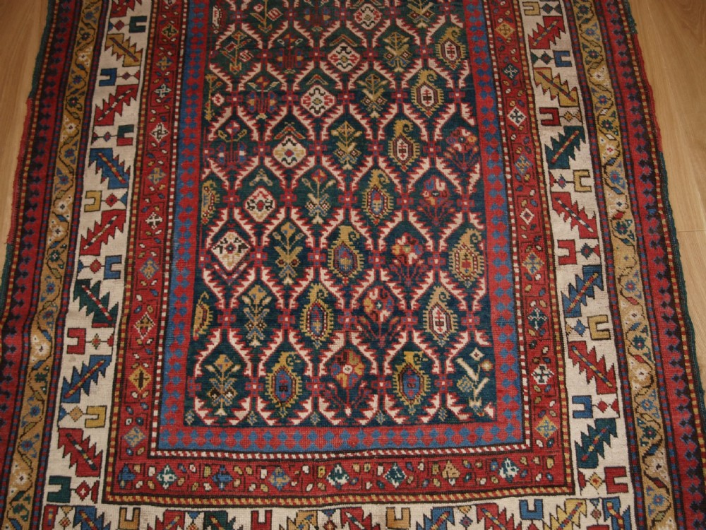 ANTIQUE CAUCASIAN DAGHESTAN RUG WITH SCARCE GREEN GROUND, LATTICE DESIGN, CIRCA 1880. View VI