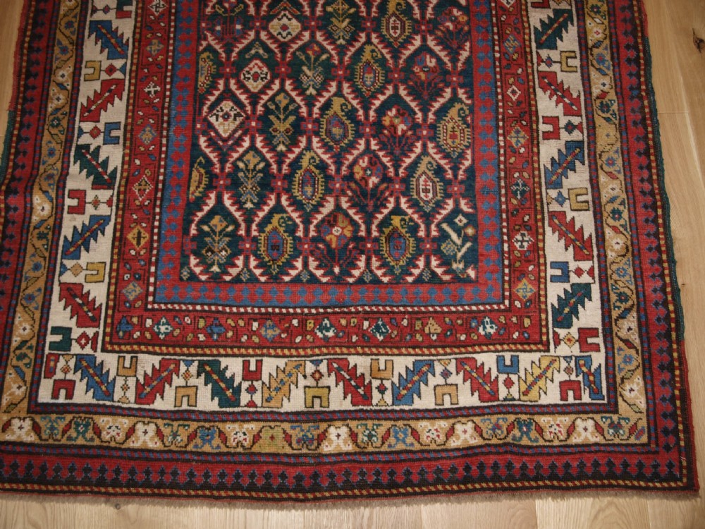 ANTIQUE CAUCASIAN DAGHESTAN RUG WITH SCARCE GREEN GROUND, LATTICE DESIGN, CIRCA 1880. View VII