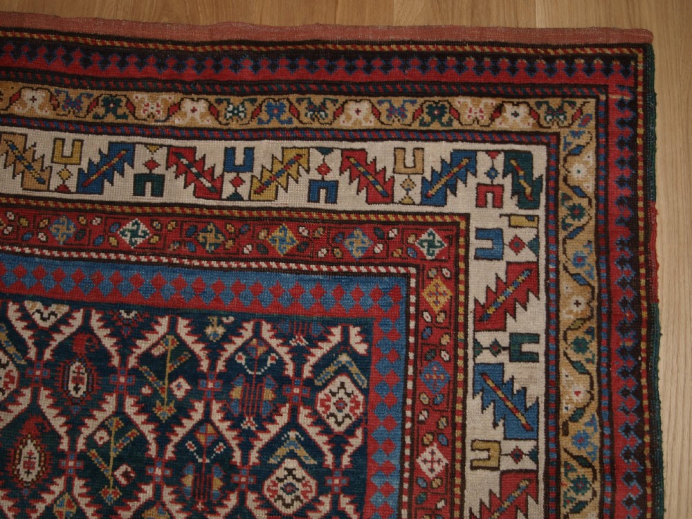 ANTIQUE CAUCASIAN DAGHESTAN RUG WITH SCARCE GREEN GROUND, LATTICE DESIGN, CIRCA 1880. View VIII