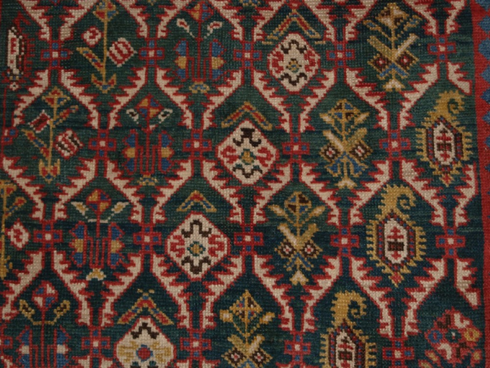 ANTIQUE CAUCASIAN DAGHESTAN RUG WITH SCARCE GREEN GROUND, LATTICE DESIGN, CIRCA 1880. View IX