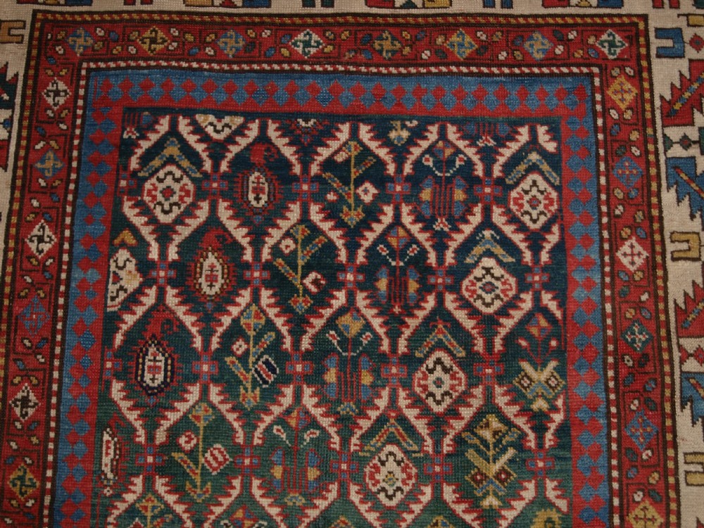 ANTIQUE CAUCASIAN DAGHESTAN RUG WITH SCARCE GREEN GROUND, LATTICE DESIGN, CIRCA 1880. View X