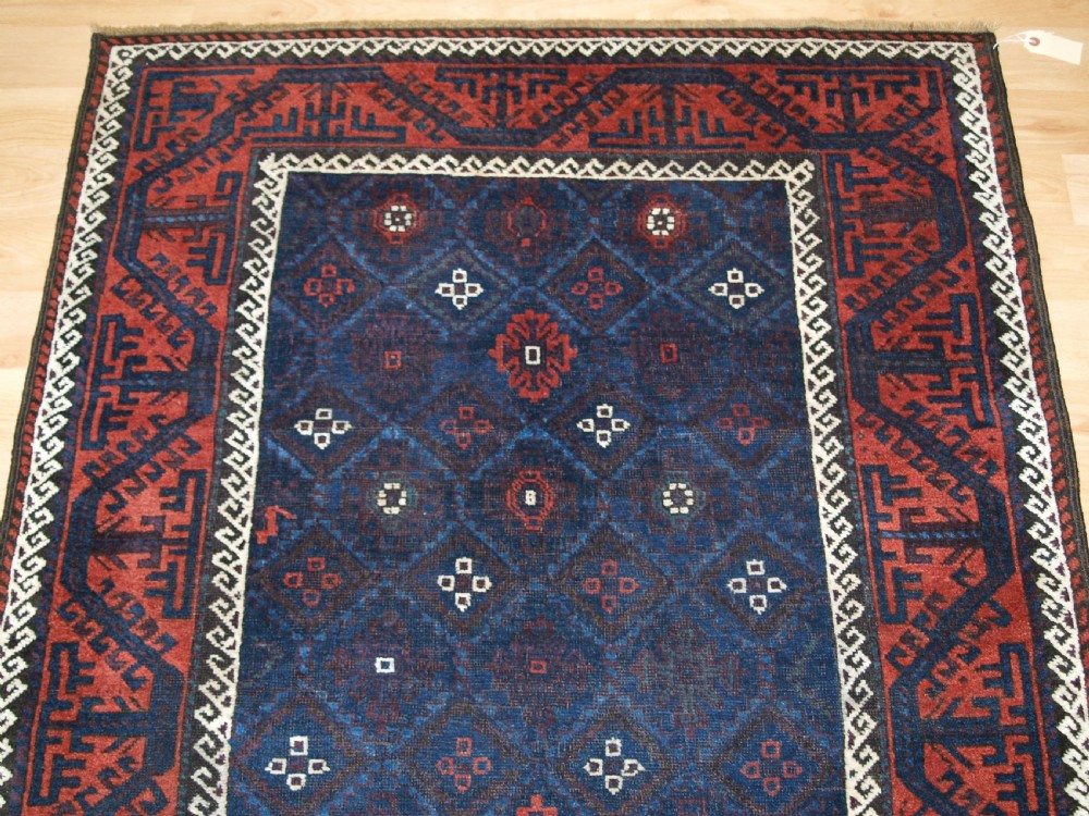ANTIQUE BALUCH RUG WITH LATTICE DESIGN IN SUPERB BLUES, BOAT BORDER, LATE 19TH CENTURY. View V
