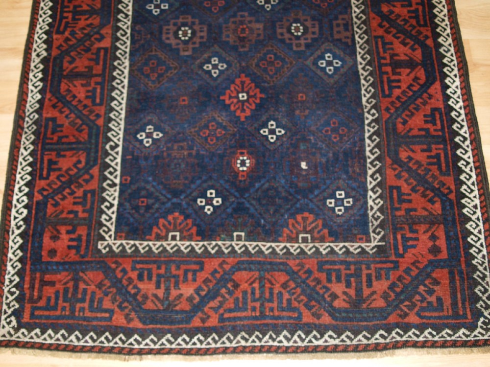 ANTIQUE BALUCH RUG WITH LATTICE DESIGN IN SUPERB BLUES, BOAT BORDER, LATE 19TH CENTURY. View VI