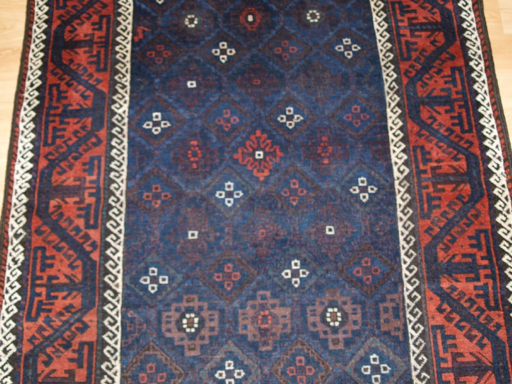 ANTIQUE BALUCH RUG WITH LATTICE DESIGN IN SUPERB BLUES, BOAT BORDER, LATE 19TH CENTURY. View VII