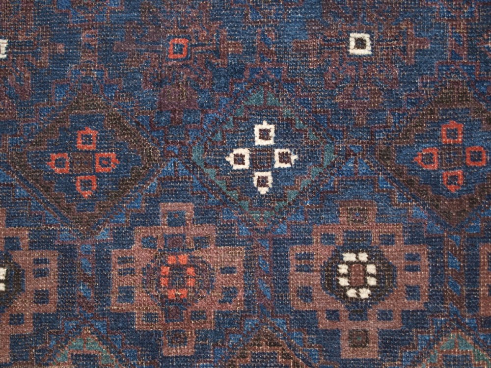 ANTIQUE BALUCH RUG WITH LATTICE DESIGN IN SUPERB BLUES, BOAT BORDER, LATE 19TH CENTURY. View VIII