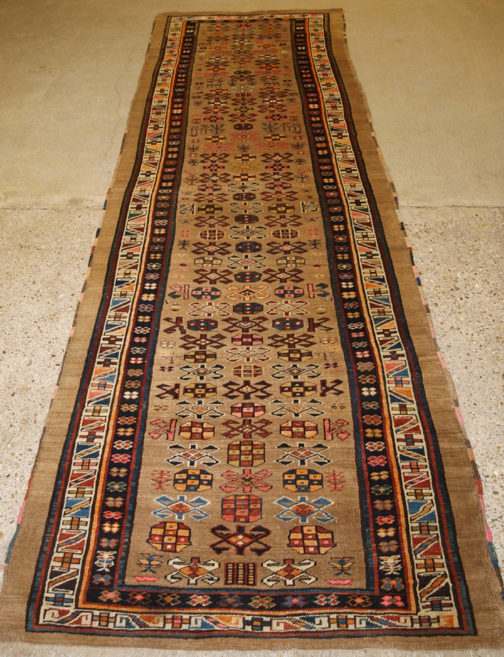 ANTIQUE SARAB RUNNER, CAMEL WOOL GROUND WITH ANIMALS, CIRCA 1900.