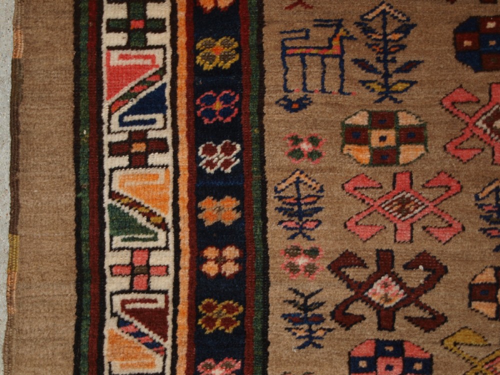 ANTIQUE SARAB RUNNER, CAMEL WOOL GROUND WITH ANIMALS, CIRCA 1900. View III