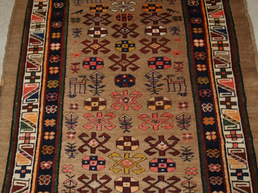 ANTIQUE SARAB RUNNER, CAMEL WOOL GROUND WITH ANIMALS, CIRCA 1900. View V