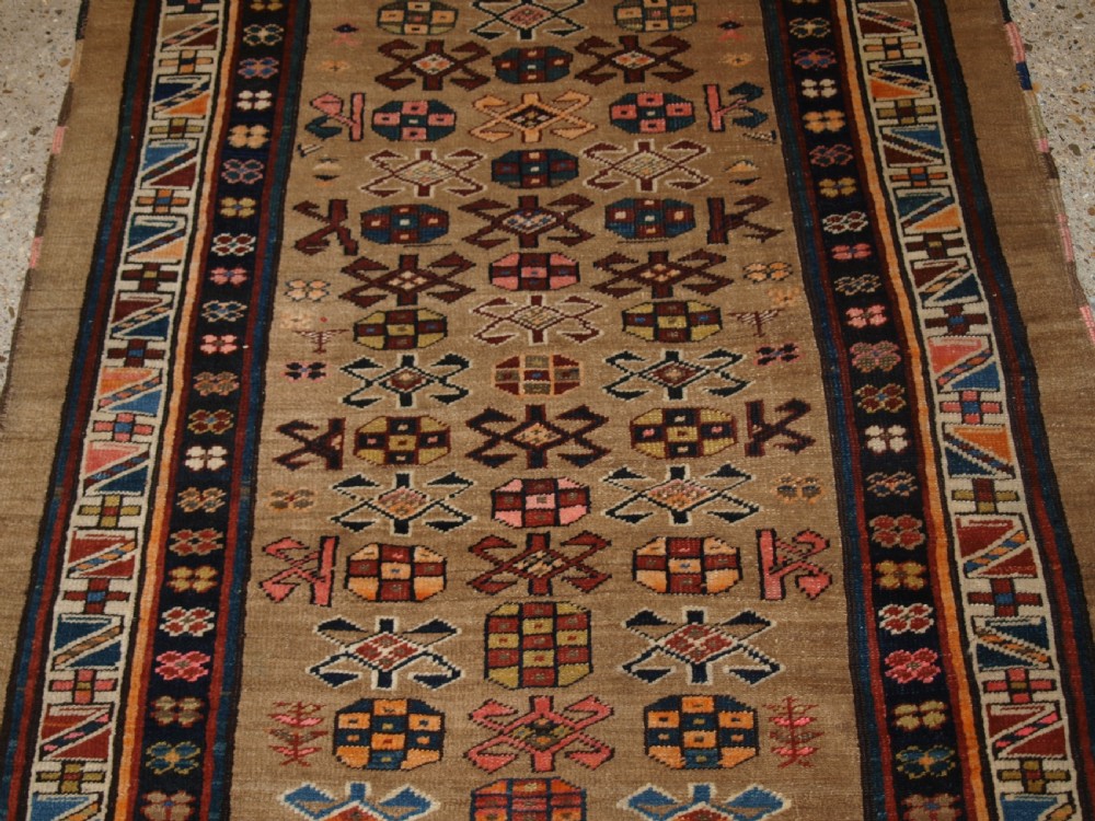 ANTIQUE SARAB RUNNER, CAMEL WOOL GROUND WITH ANIMALS, CIRCA 1900. View VII