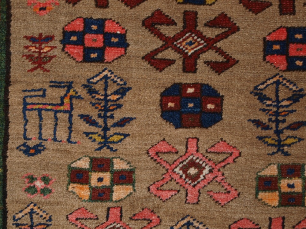 ANTIQUE SARAB RUNNER, CAMEL WOOL GROUND WITH ANIMALS, CIRCA 1900. View X