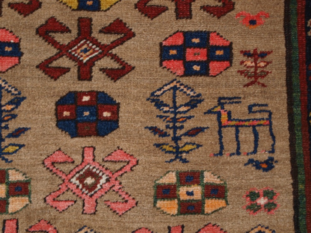 ANTIQUE SARAB RUNNER, CAMEL WOOL GROUND WITH ANIMALS, CIRCA 1900. View XI