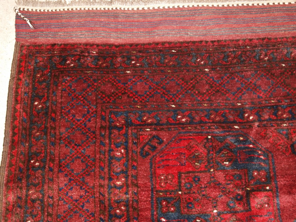 OLD RED AFGHAN VILLAGE CARPET, OUTSTANDING CONDITION, DEEP RED COLOUR, CIRCA 1920. View II