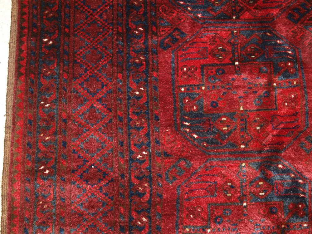 OLD RED AFGHAN VILLAGE CARPET, OUTSTANDING CONDITION, DEEP RED COLOUR, CIRCA 1920. View III