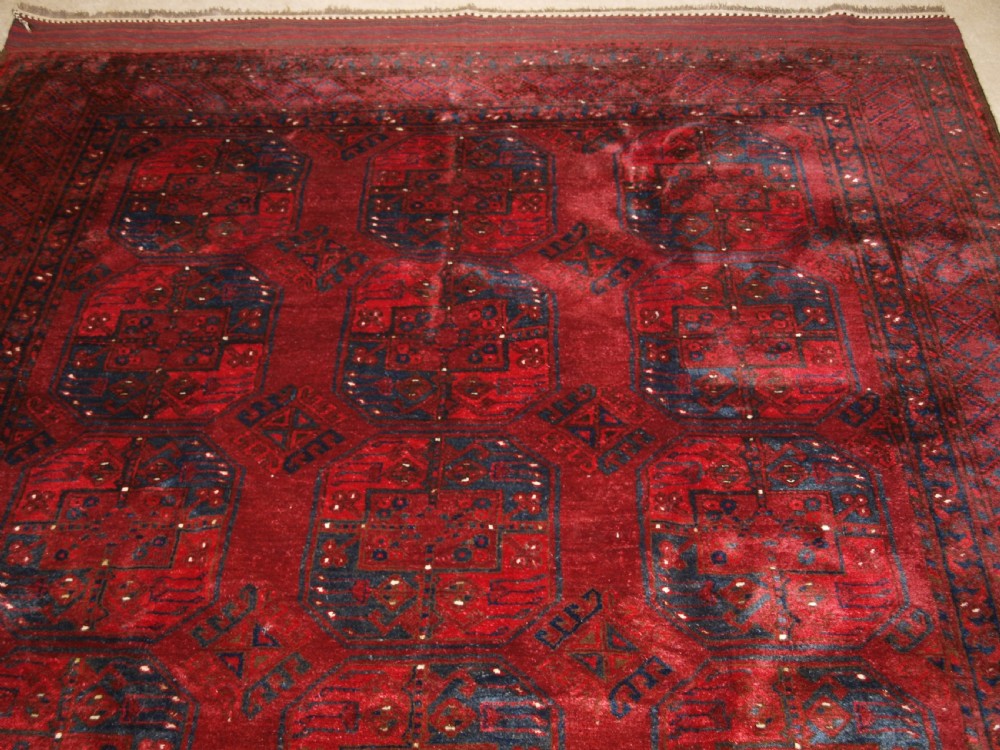 OLD RED AFGHAN VILLAGE CARPET, OUTSTANDING CONDITION, DEEP RED COLOUR, CIRCA 1920. View IV