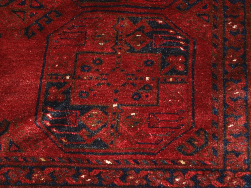 OLD RED AFGHAN VILLAGE CARPET, OUTSTANDING CONDITION, DEEP RED COLOUR, CIRCA 1920. View IX