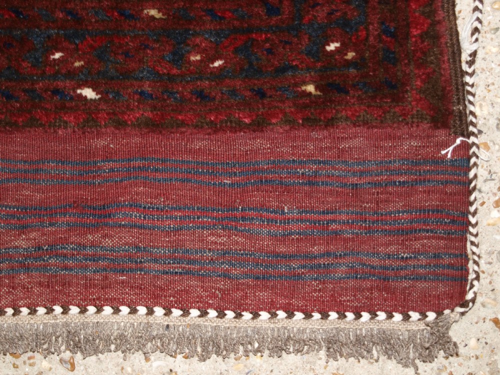 OLD RED AFGHAN VILLAGE CARPET, OUTSTANDING CONDITION, DEEP RED COLOUR, CIRCA 1920. View X