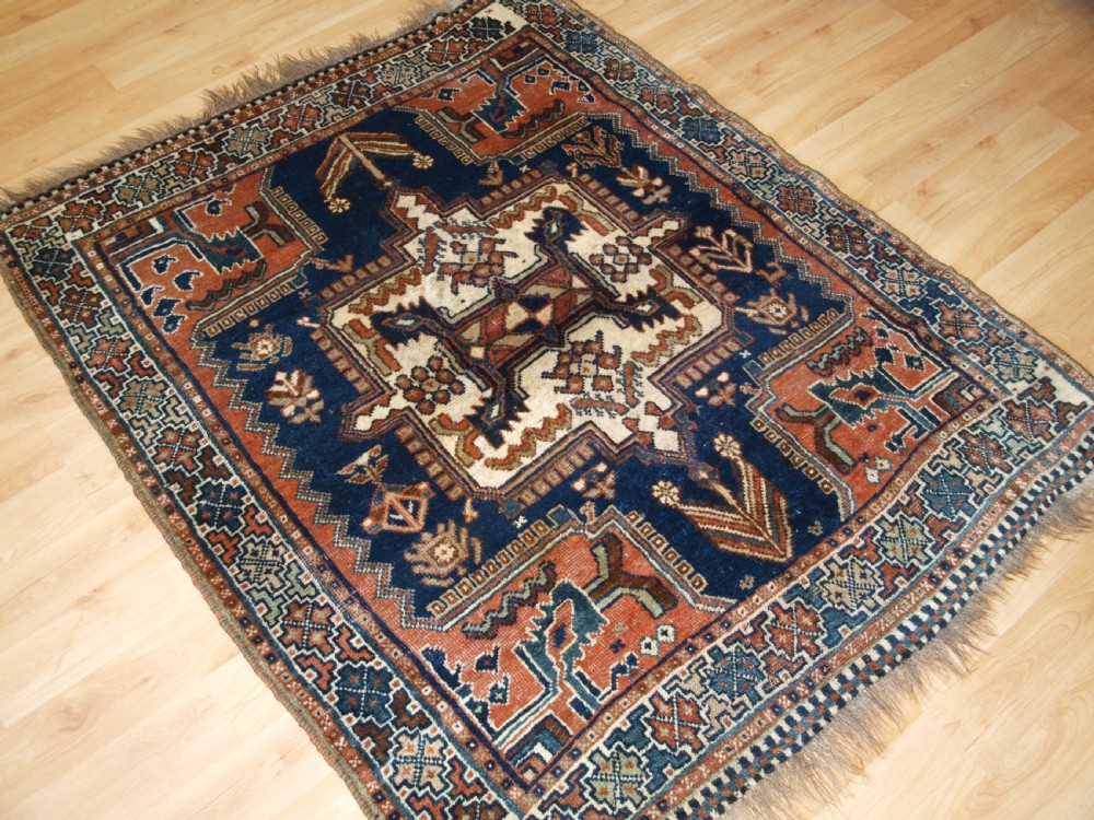 ANTIQUE RUG BY THE LURI TRIBE, SMALL TRIBAL RUG, CIRCA 1900. View II