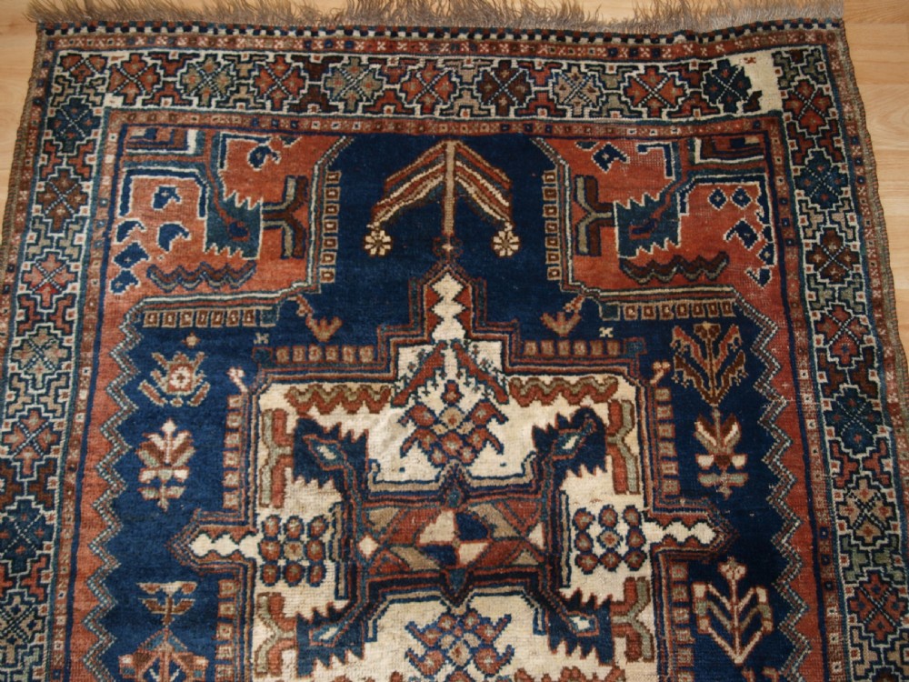 ANTIQUE RUG BY THE LURI TRIBE, SMALL TRIBAL RUG, CIRCA 1900. View IV