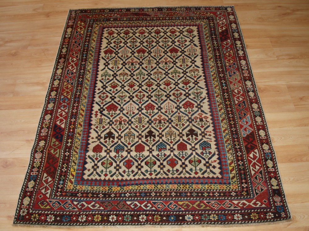 ANTIQUE CAUCASIAN DAGHESTAN RUG WITH IVORY GROUND FLORAL LATTICE, SUPERB, CIRCA 1880.