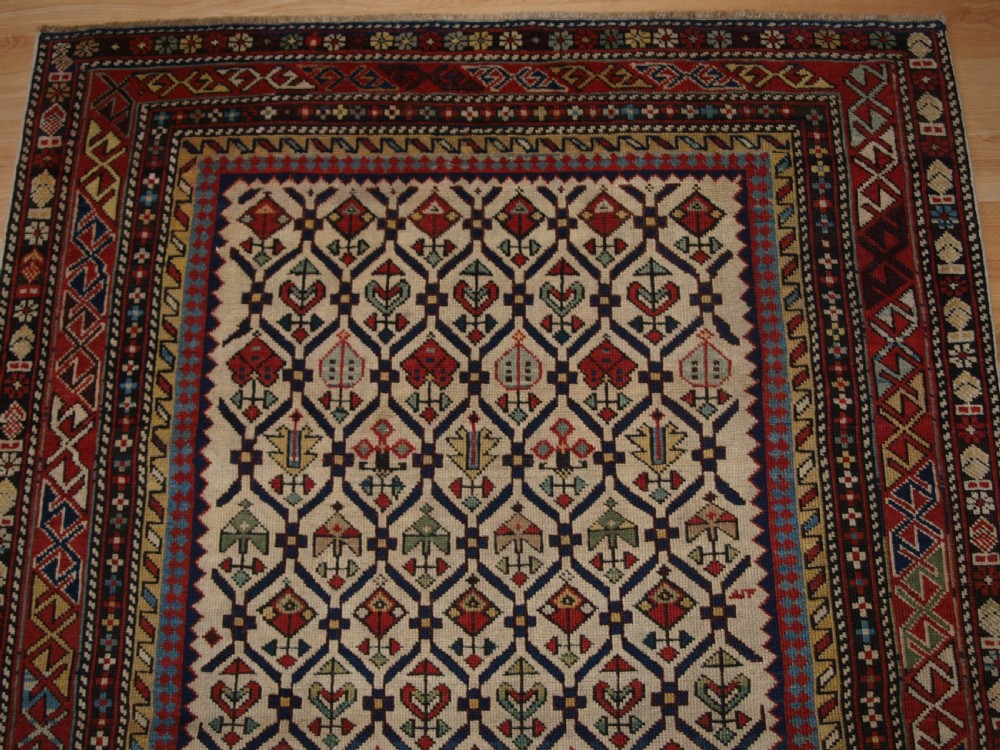 ANTIQUE CAUCASIAN DAGHESTAN RUG WITH IVORY GROUND FLORAL LATTICE, SUPERB, CIRCA 1880. View IV
