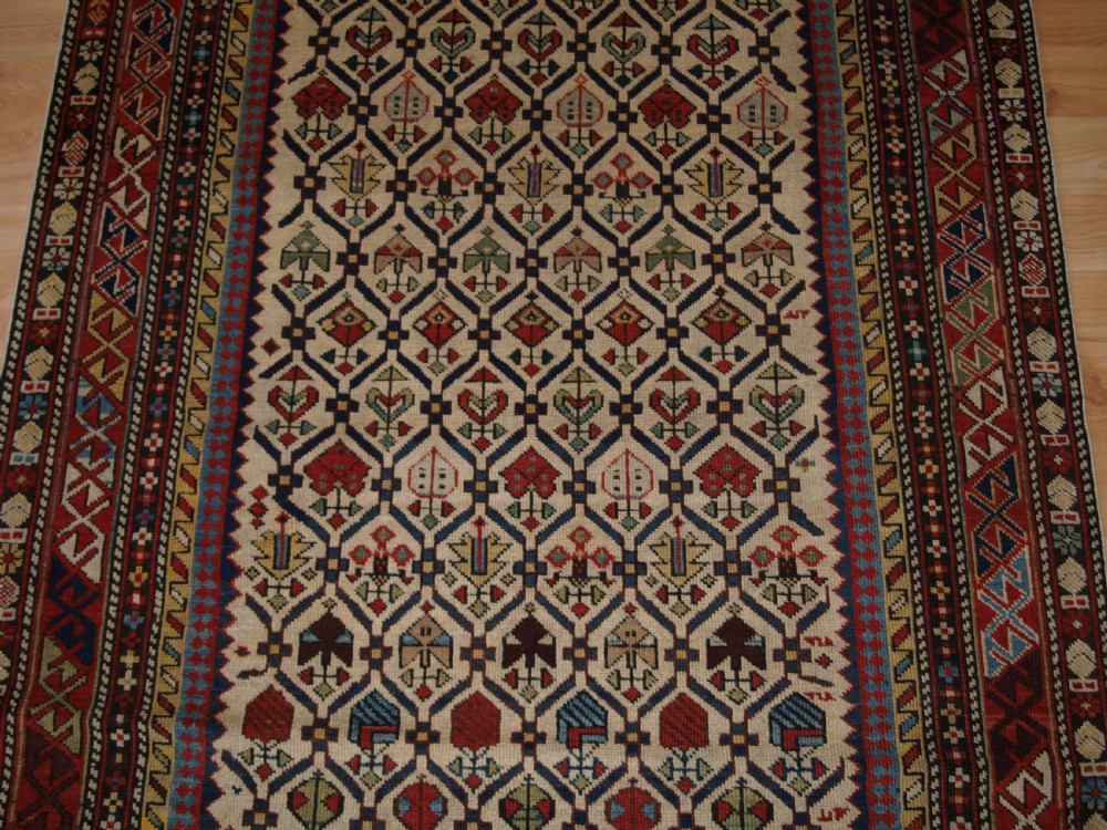 ANTIQUE CAUCASIAN DAGHESTAN RUG WITH IVORY GROUND FLORAL LATTICE, SUPERB, CIRCA 1880. View V
